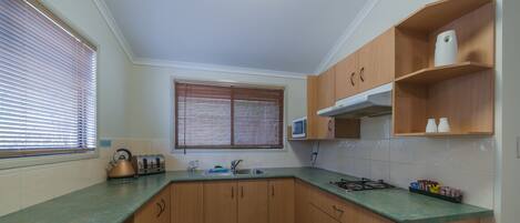 Apartment, 2 Bedrooms | Private kitchen | Fridge, microwave, stovetop, electric kettle
