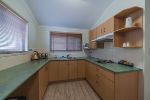 Apartment, 2 Bedrooms | Private kitchen | Fridge, microwave, stovetop, electric kettle