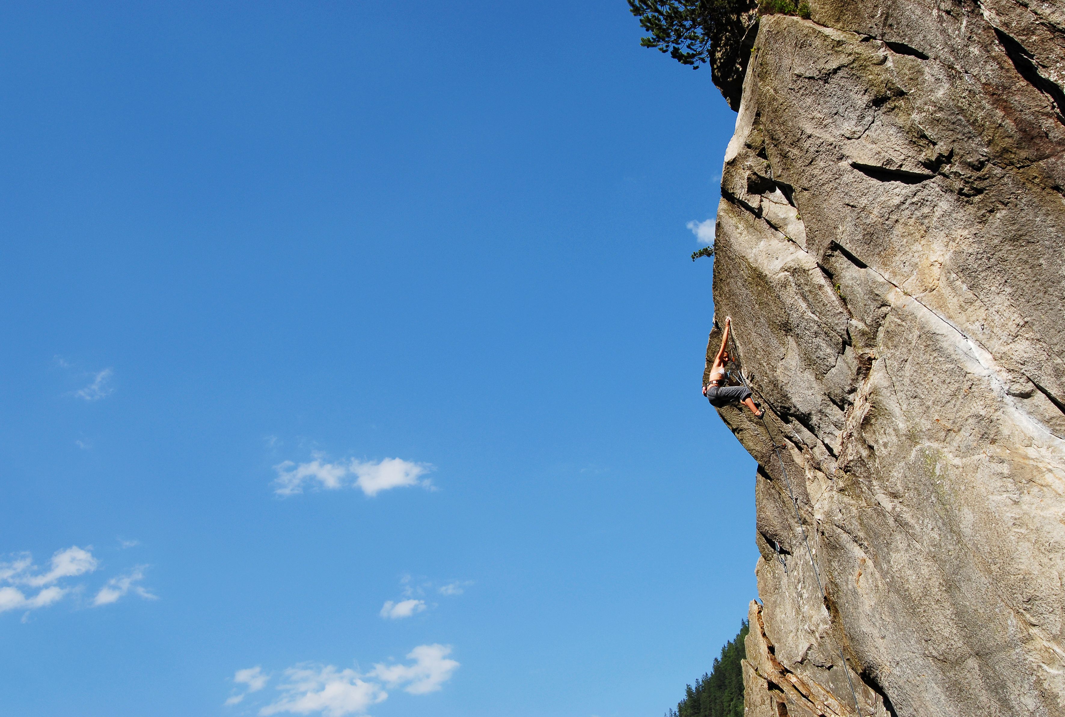 A rock face with a climber.