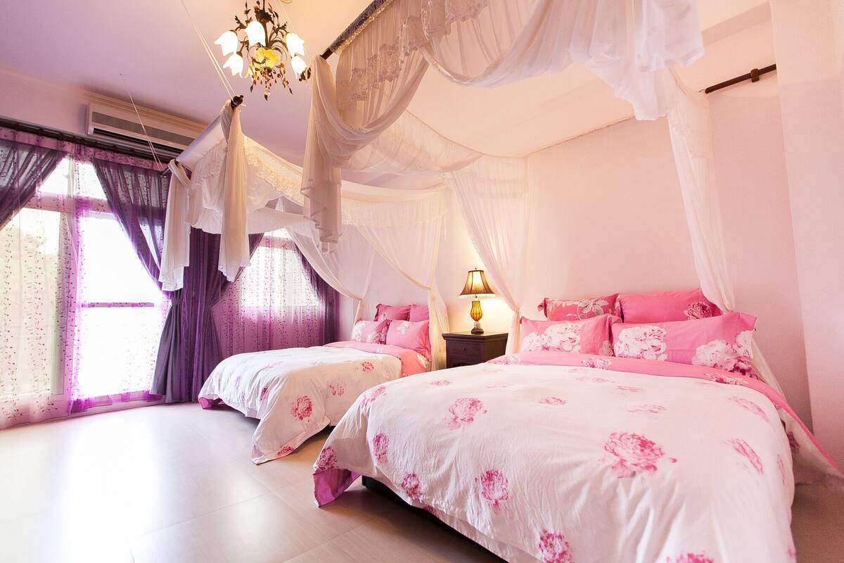 Quadruple Deluxe | Premium bedding, down comforters, blackout drapes