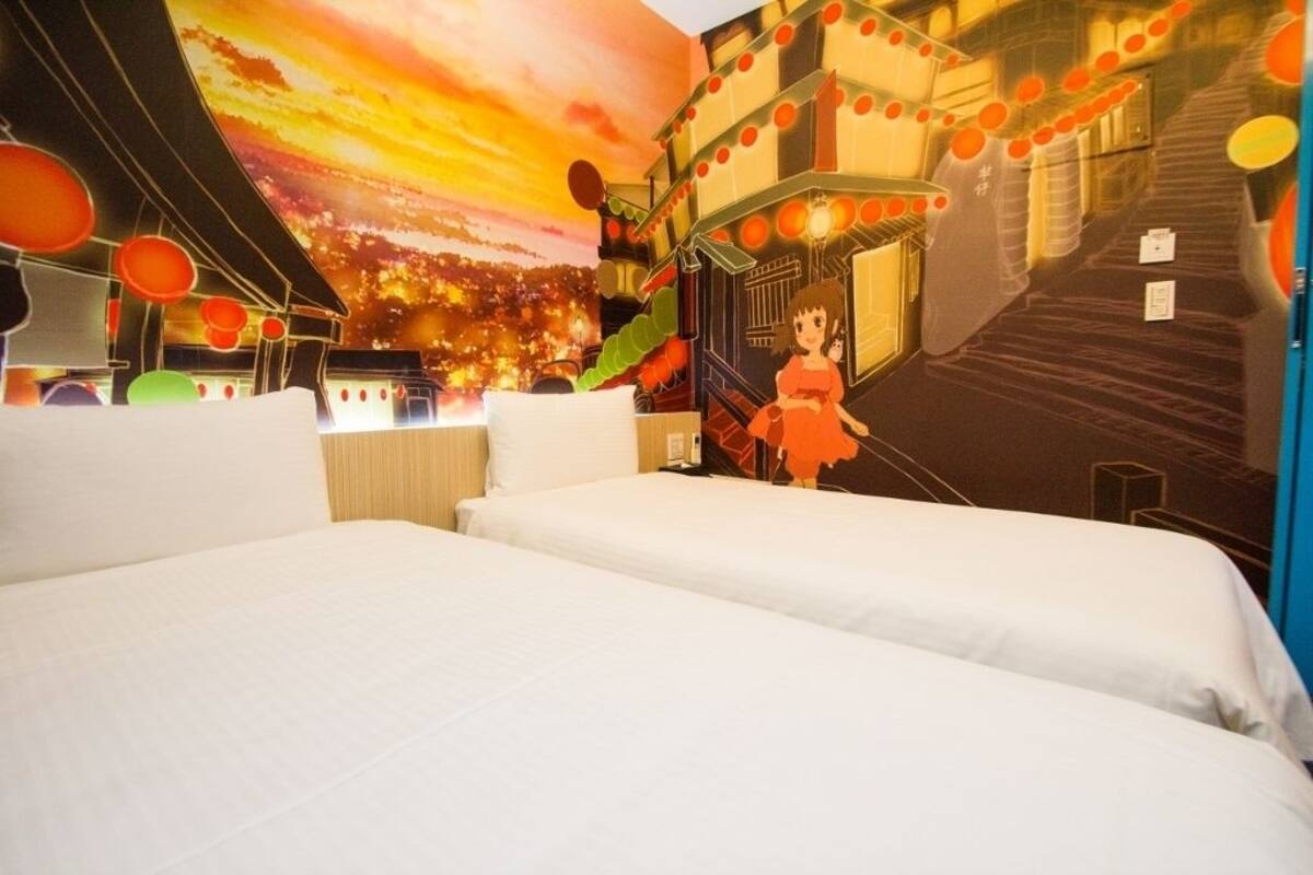 A hotel room with two beds, a mural of a cityscape, and a staircase with red lanterns.