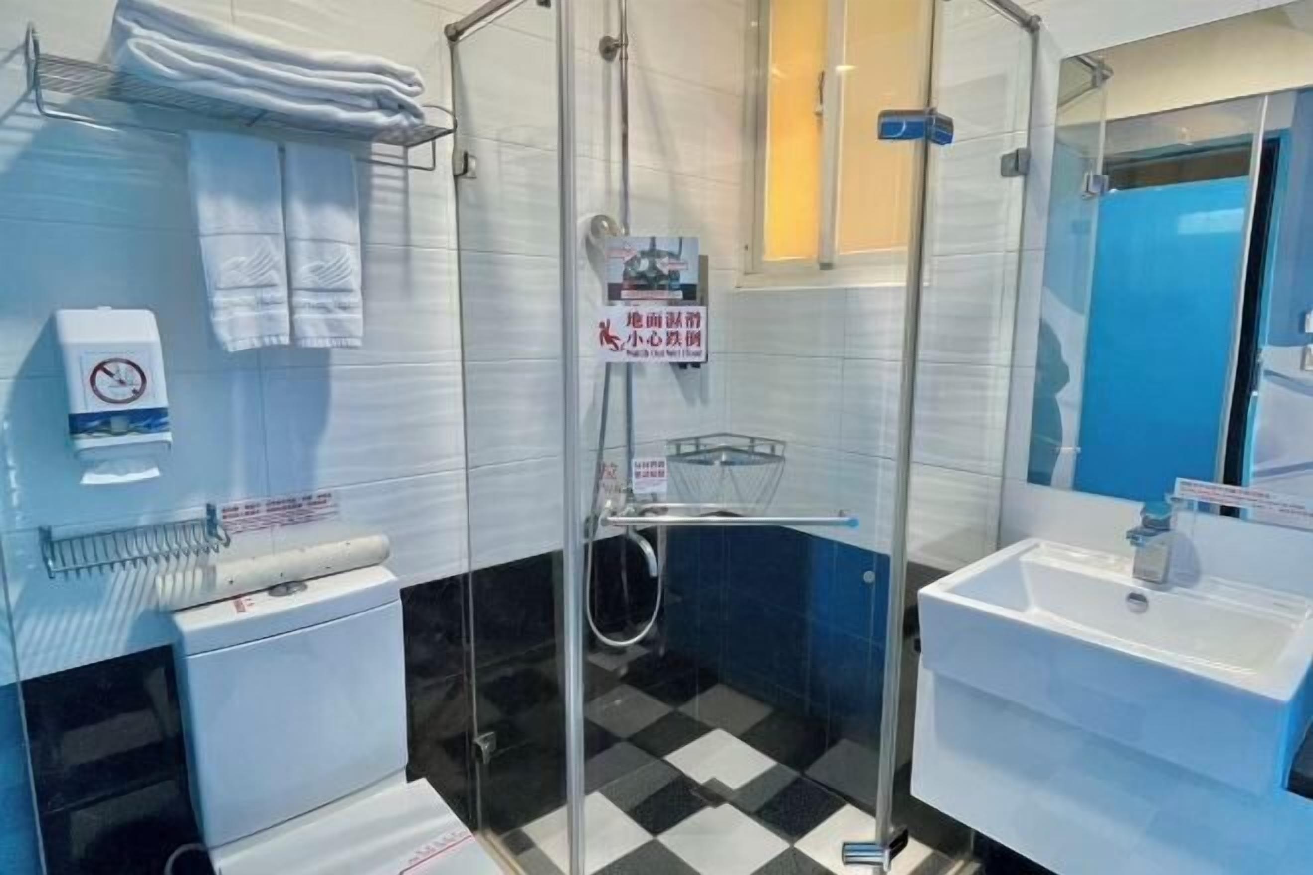 Shower, hair dryer, towels, shampoo