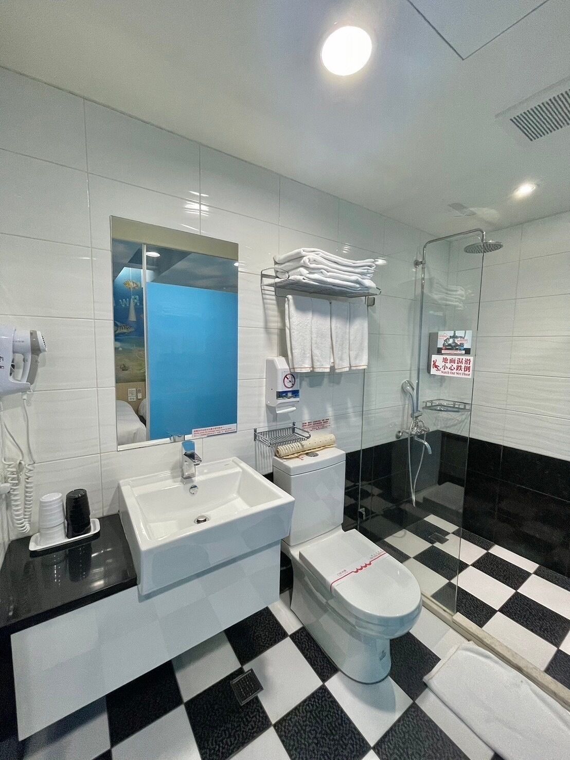 family room | bathroom | shower, hair dryer, towels, shampoo