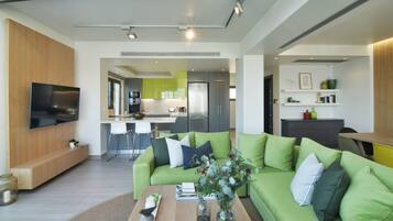 Villa | Living area | 60-inch flat-screen TV with satellite channels, plasma TV, DVD player