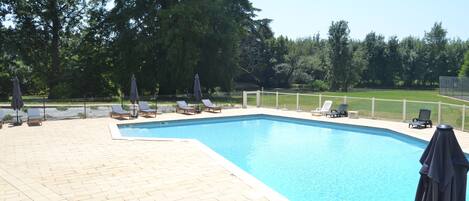 Seasonal outdoor pool, open 9:30 AM to 7:00 PM, pool umbrellas