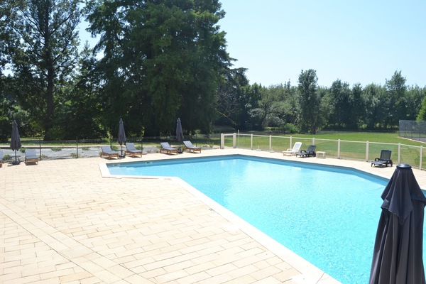 Seasonal outdoor pool, open 9:30 AM to 7:00 PM, pool umbrellas