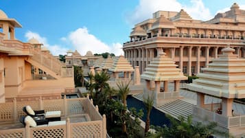 A luxurious resort with multiple buildings featuring traditional architecture, including domes and intricate designs.