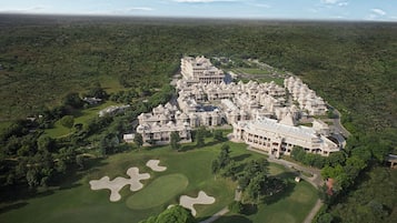 Set amidst lush greenery and manicured lawns, this resort offers a tranquil retreat with golf course views.
