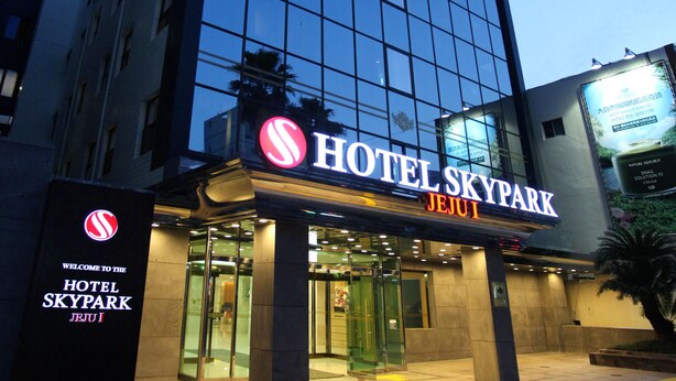 The exterior of Hotel Skypark Jeju with a prominent sign and entrance. - Hotel Skypark Jeju 1 (Jeju City)