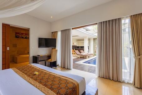 In-room safe, desk, laptop workspace, blackout drapes. The Light Exclusive Villas & SPA