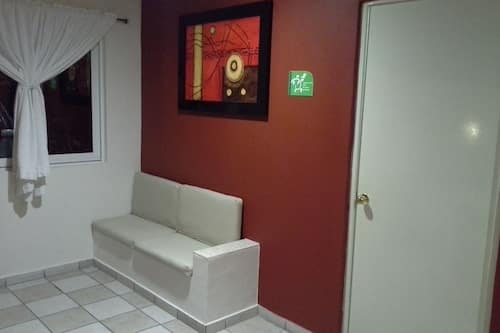 Double Room | Living area | 32-inch flat-screen TV with cable channels, TV