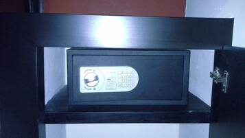 A safe with a keypad and a lock mechanism.