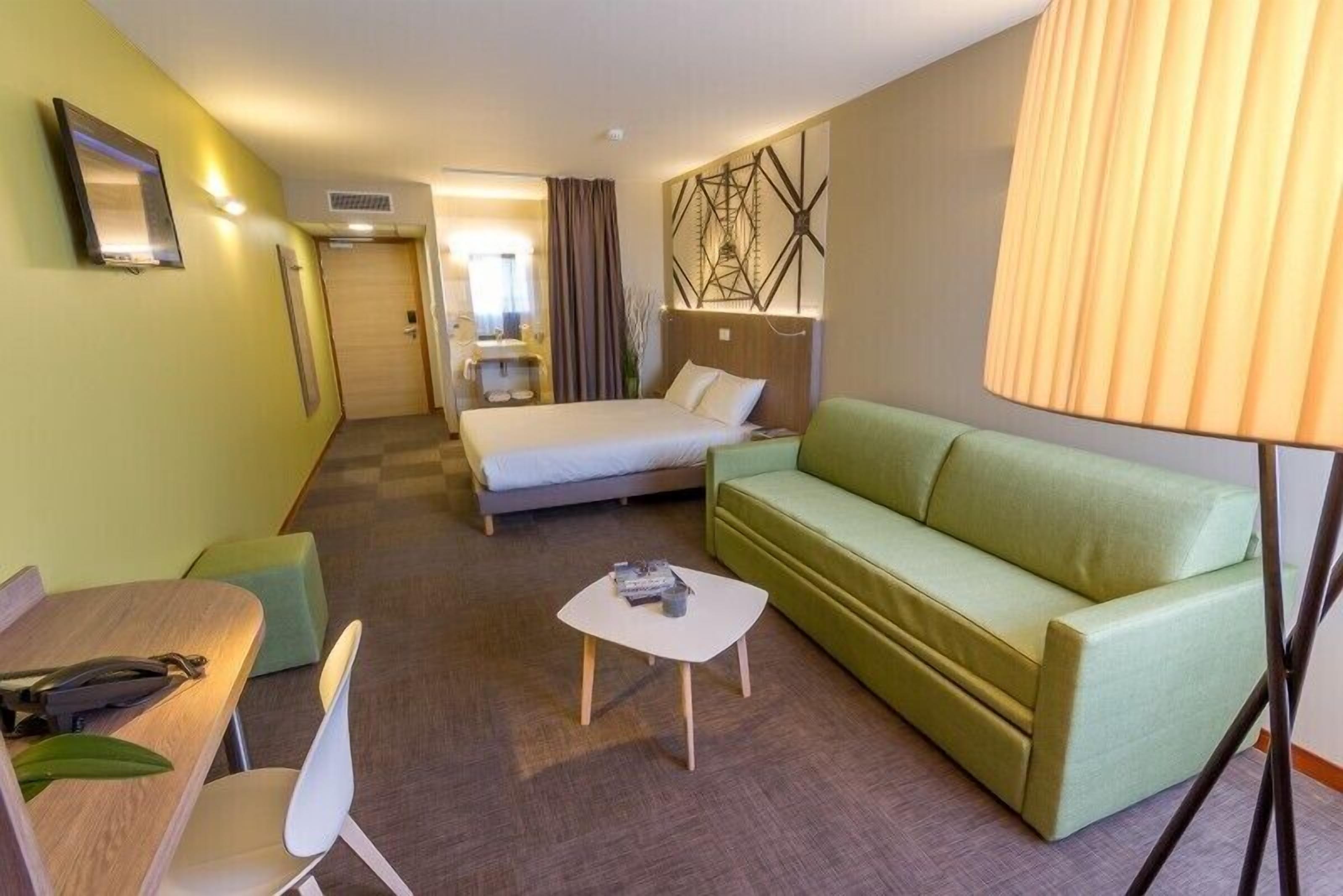 junior suite | living area | flat-screen tv