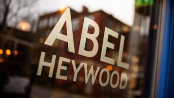 A window with the text 'ABEL HEYWOOD' in large letters.