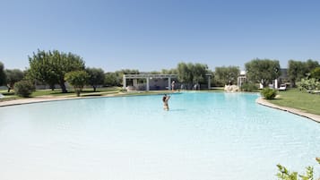 Seasonal outdoor pool, pool loungers