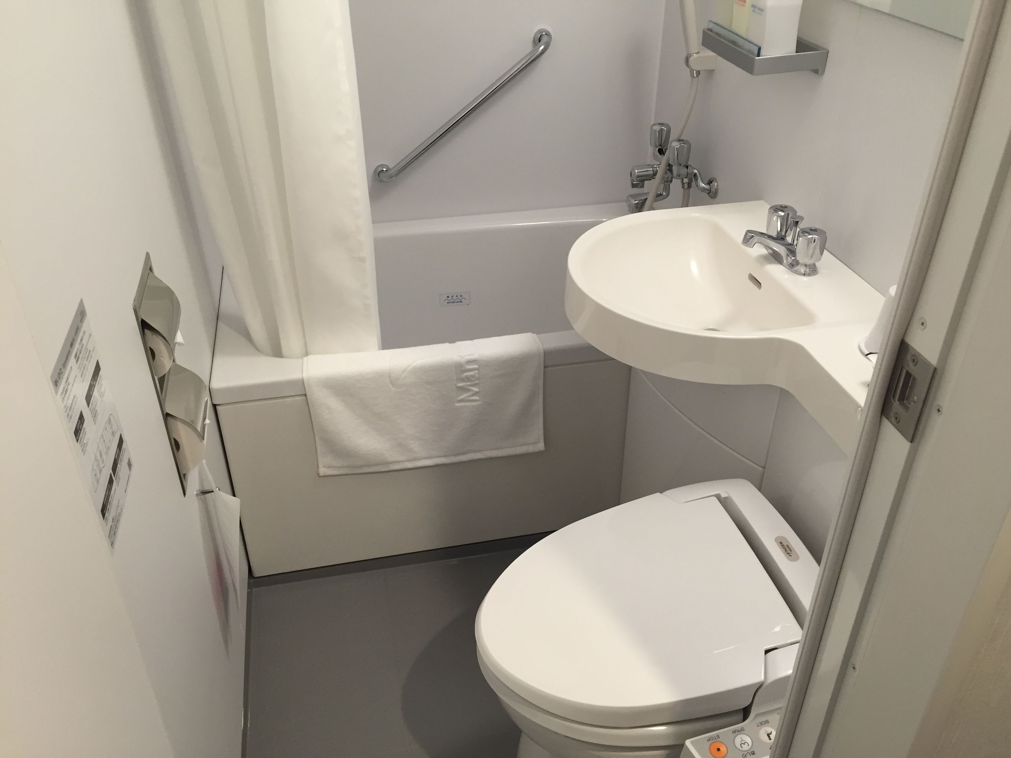 combined shower/bathtub, hair dryer, slippers, electronic bidet