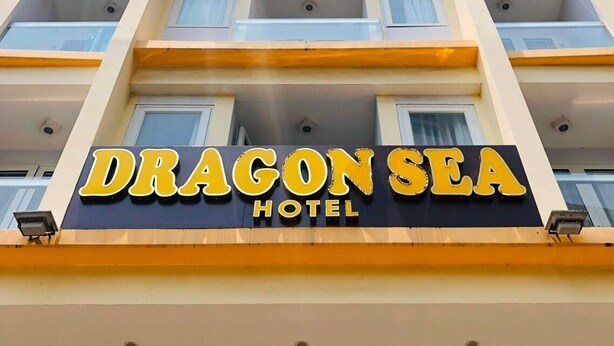 A multi-story hotel with balconies and a sign reading "Dragon Sea Hotel". - Dragon Sea Hotel (Da Nang)