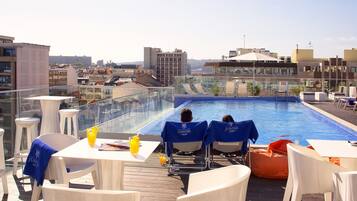 Indoor pool, pool umbrellas, pool loungers