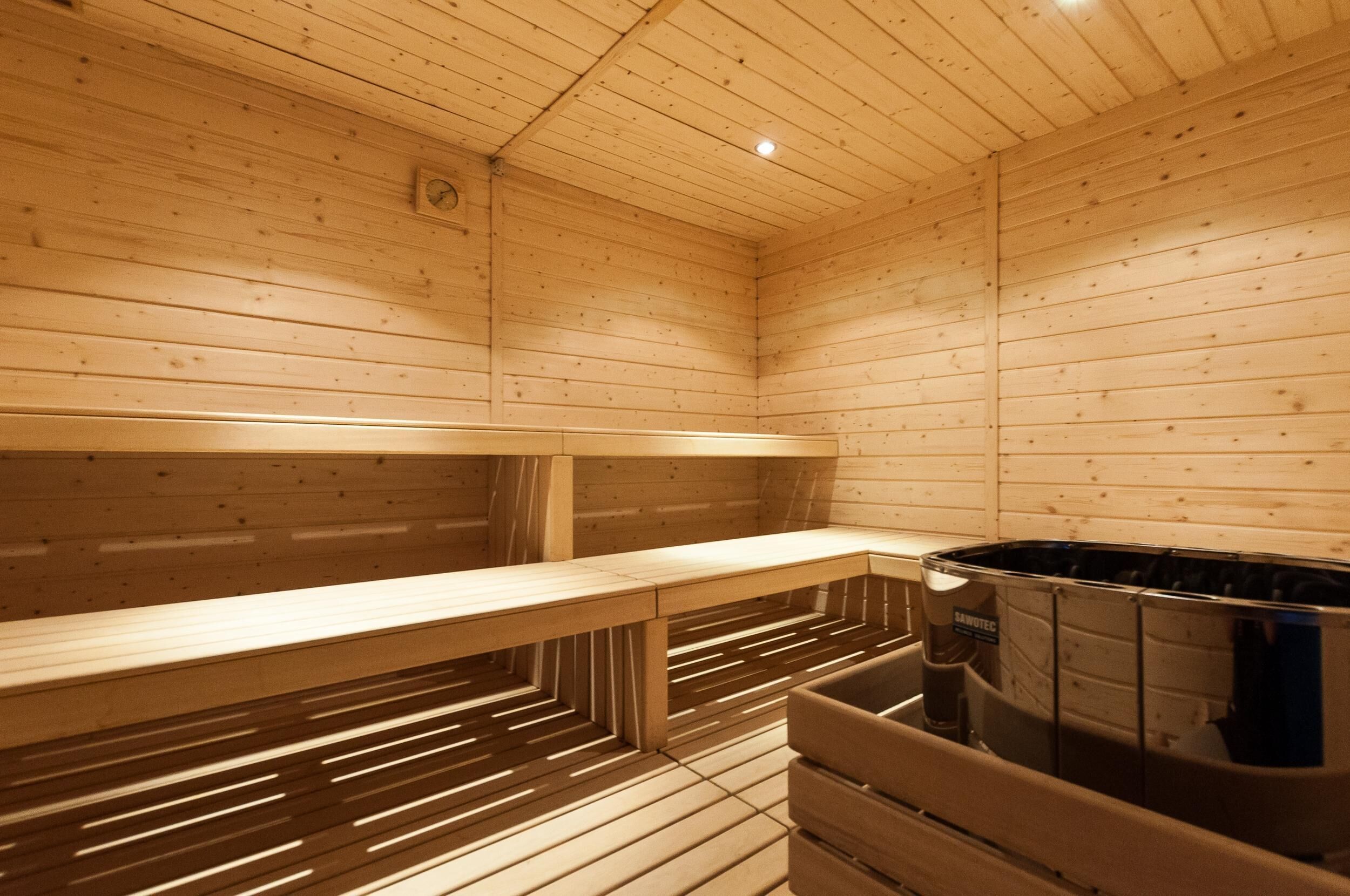 A sauna with wooden walls and benches.