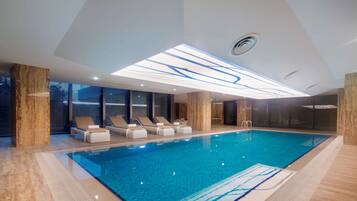 Indoor pool, open noon to 9:00 PM, pool loungers