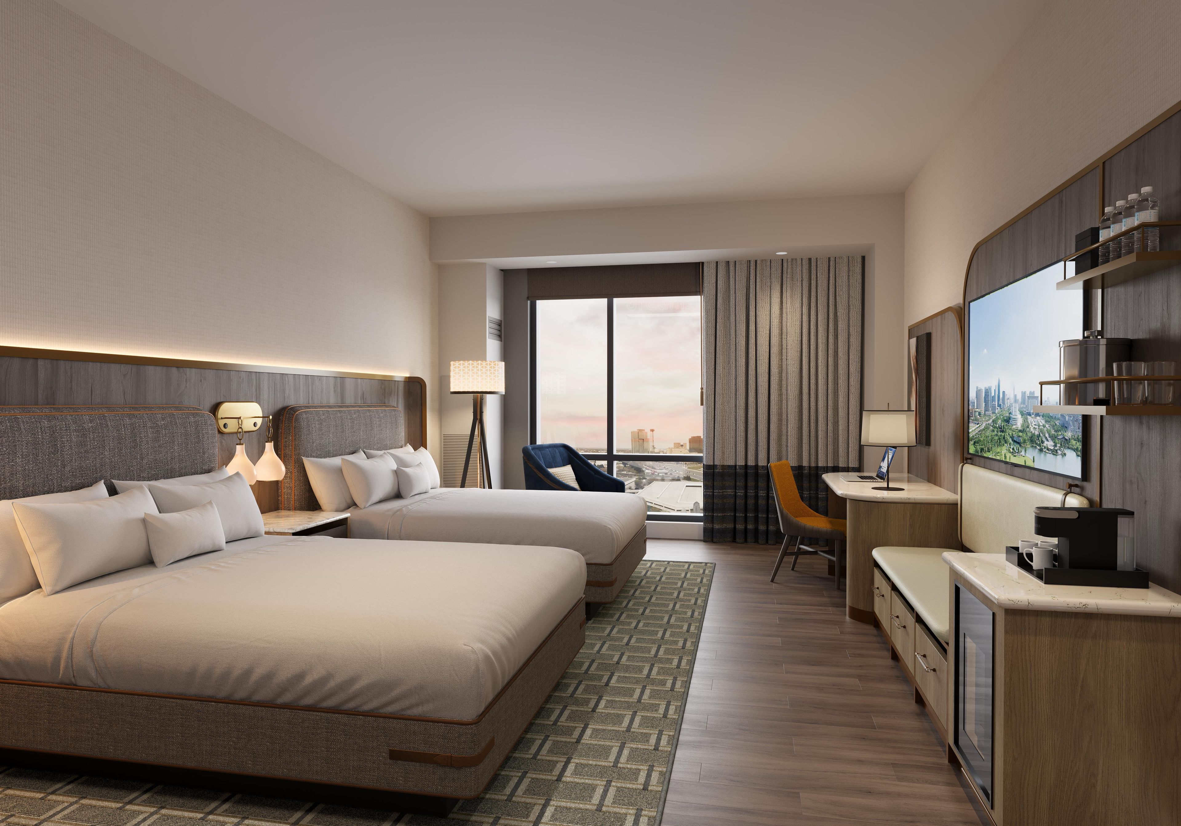 A hotel room with a large bed, a desk, a chair, and a city view.