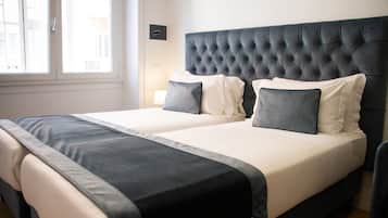 Habitación Confort con 1 cama matrimonial o 2 individuales | Ropa de cama de alta calidad, edredón y minibar