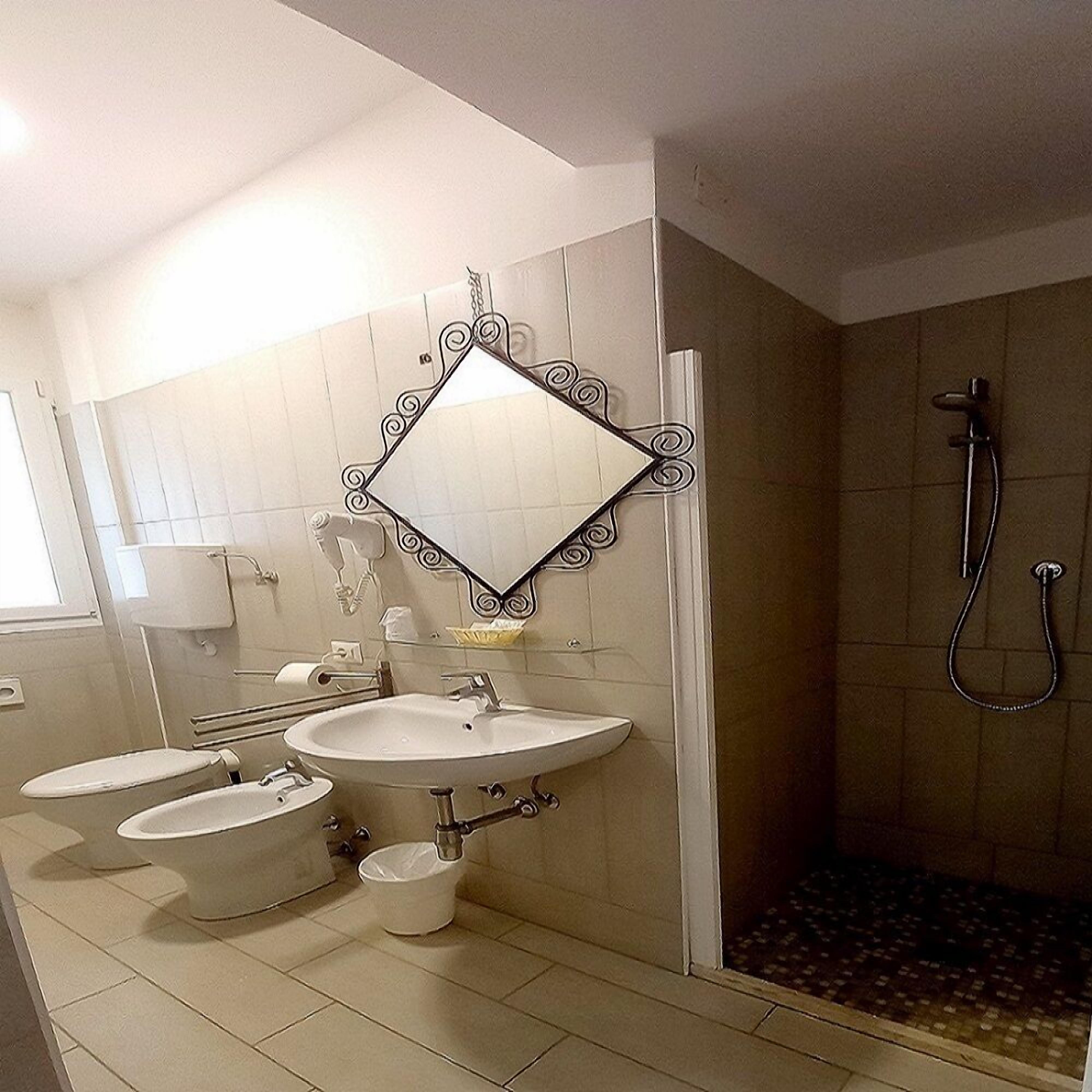 family room | bathroom | shower, rainfall showerhead, free toiletries, hair dryer