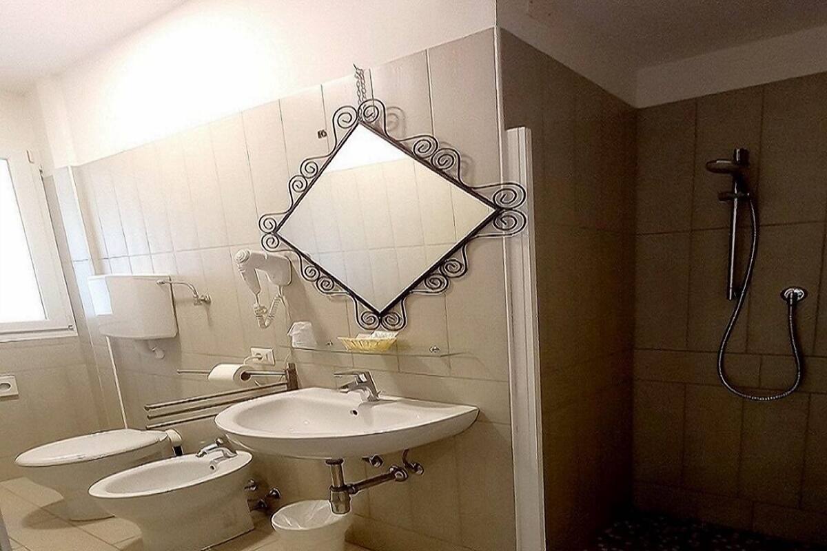 family room | bathroom | shower, rainfall showerhead, free toiletries, hair dryer