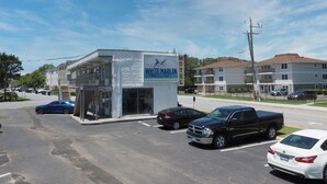 A motel with a sign reading "WHITE MARLIN MILEO". - White Marlin Inn (Virginia Beach)