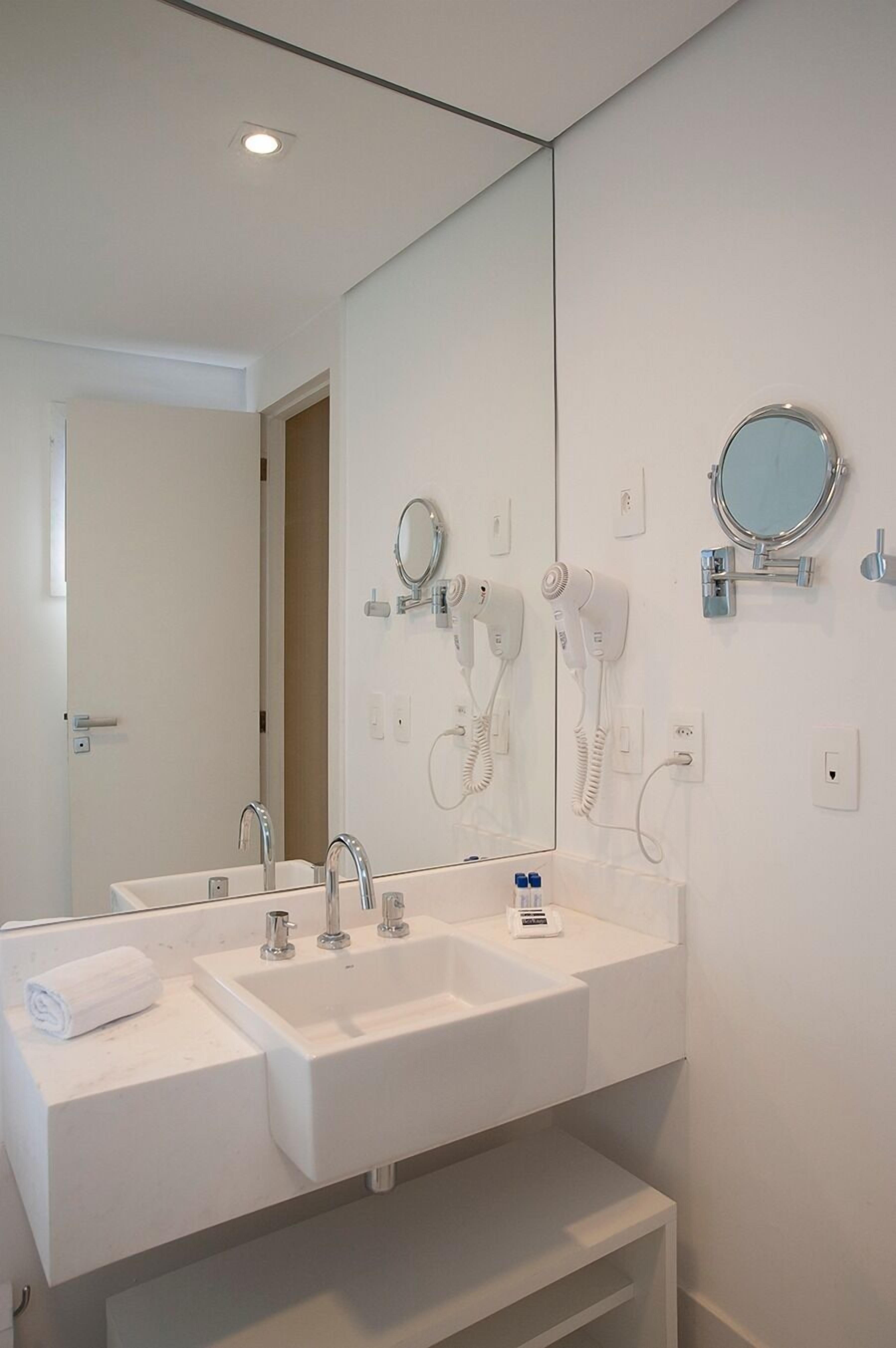 shower, designer toiletries, hair dryer, towels