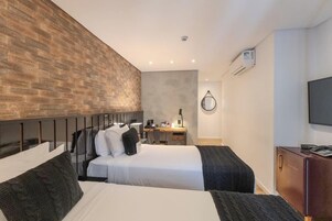 Premium Suite, Multiple Beds | Minibar, in-room safe, individually decorated, desk