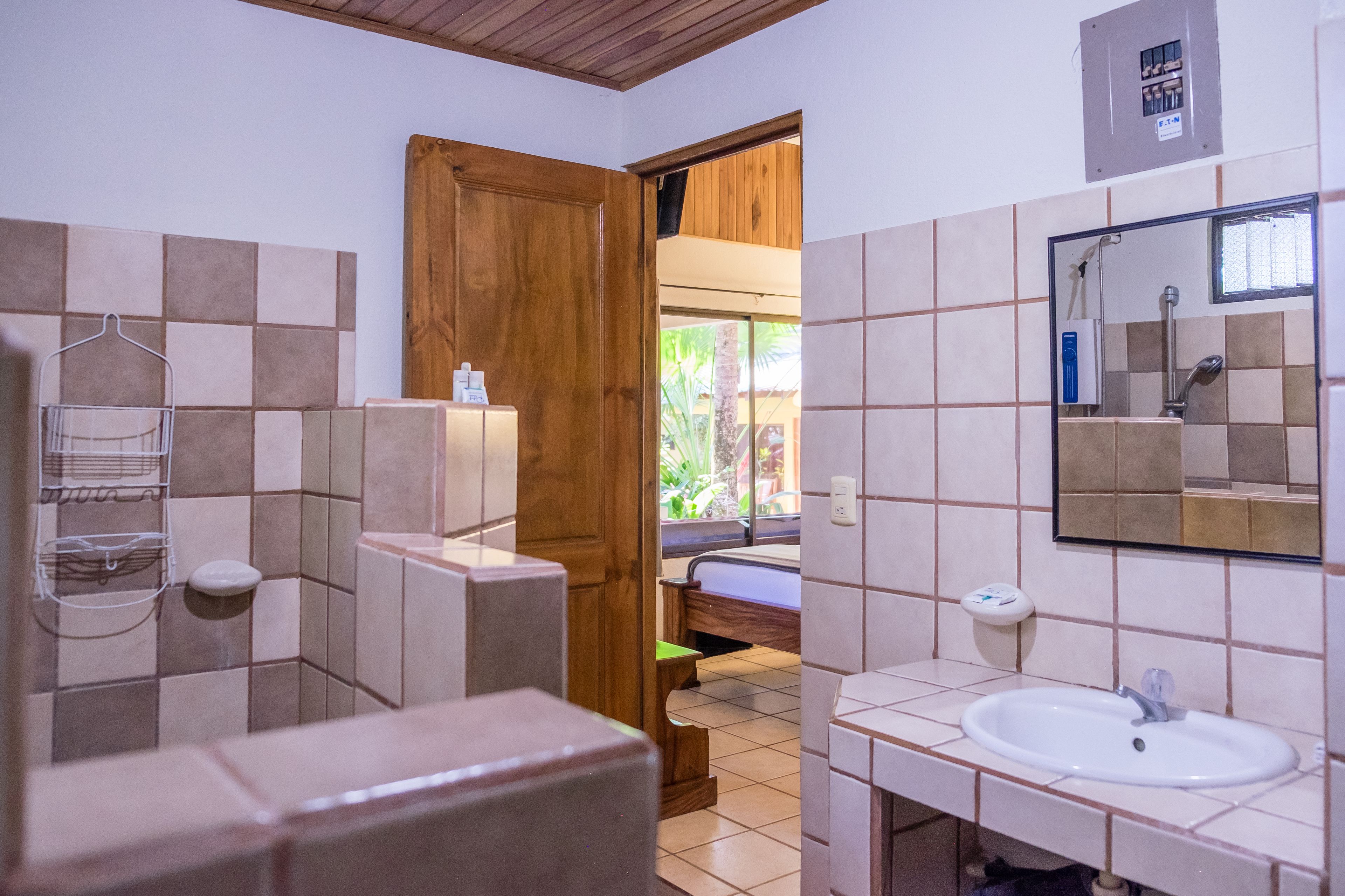 junior bungalow, 2 bedrooms, pool view, garden area | bathroom | shower, free toiletries, hair dryer, towels