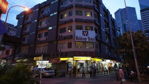 A multi-story hotel with signage for 'Meldrum Hotel' and 'Kodak' on the ground floor. - Meldrum Hotel (Johor Bahru)