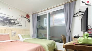 Family Room | Desk, blackout curtains, iron/ironing board, free WiFi