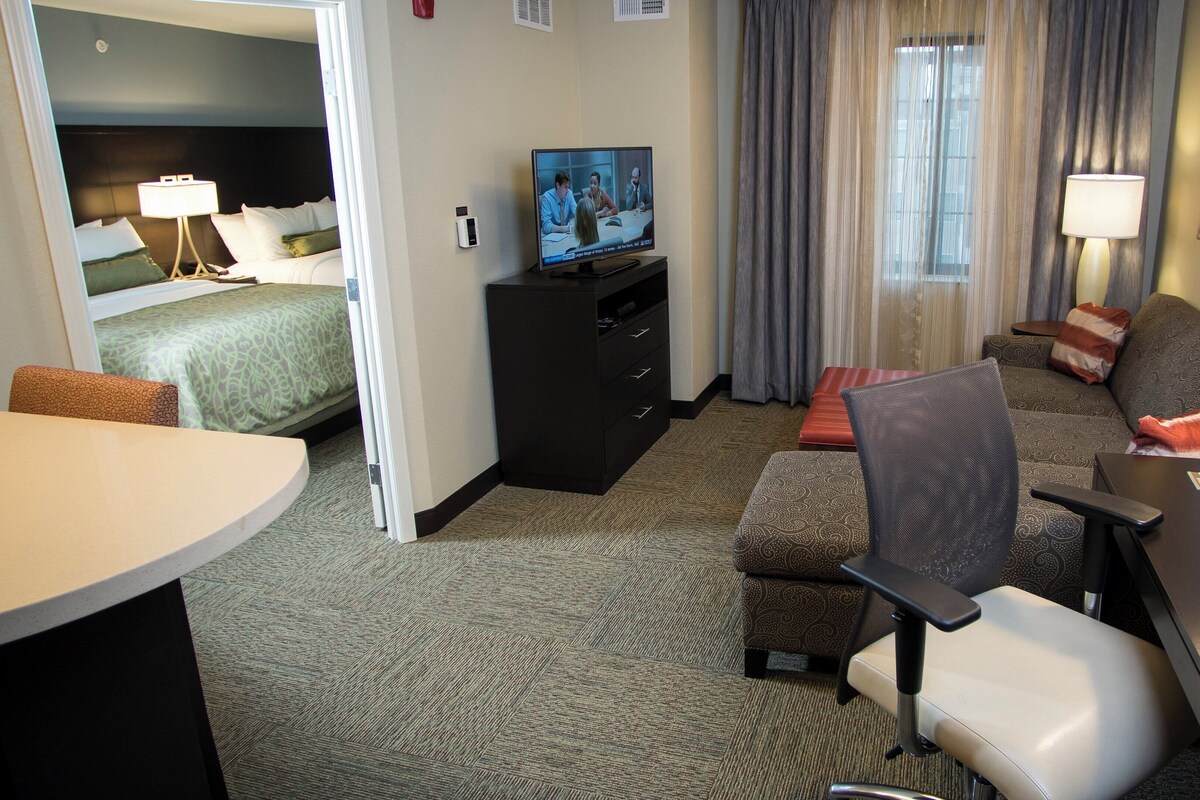 Desk, laptop workspace, blackout drapes, iron/ironing board
