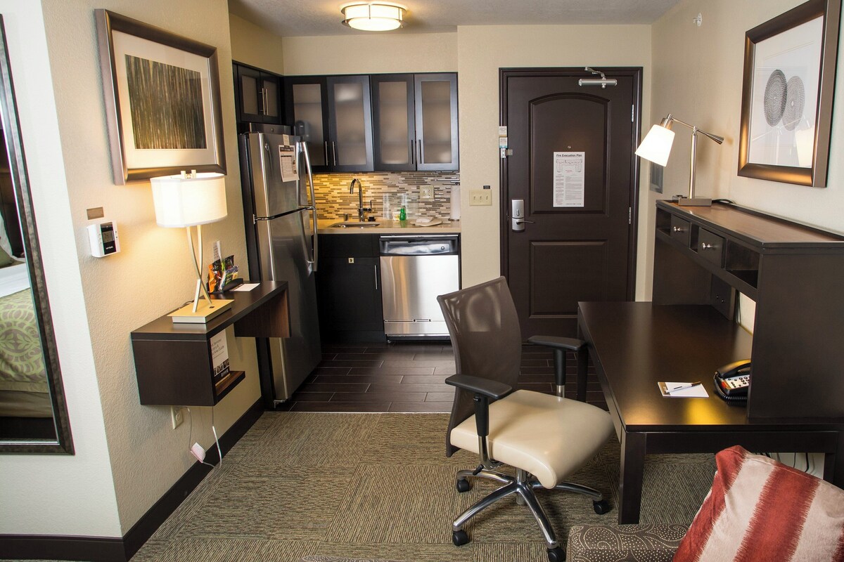 Desk, laptop workspace, blackout drapes, iron/ironing board