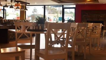 Breakfast, lunch served; international cuisine, pool views