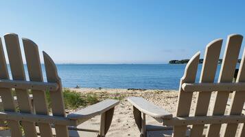 On the beach, sun-loungers, beach umbrellas, beach towels