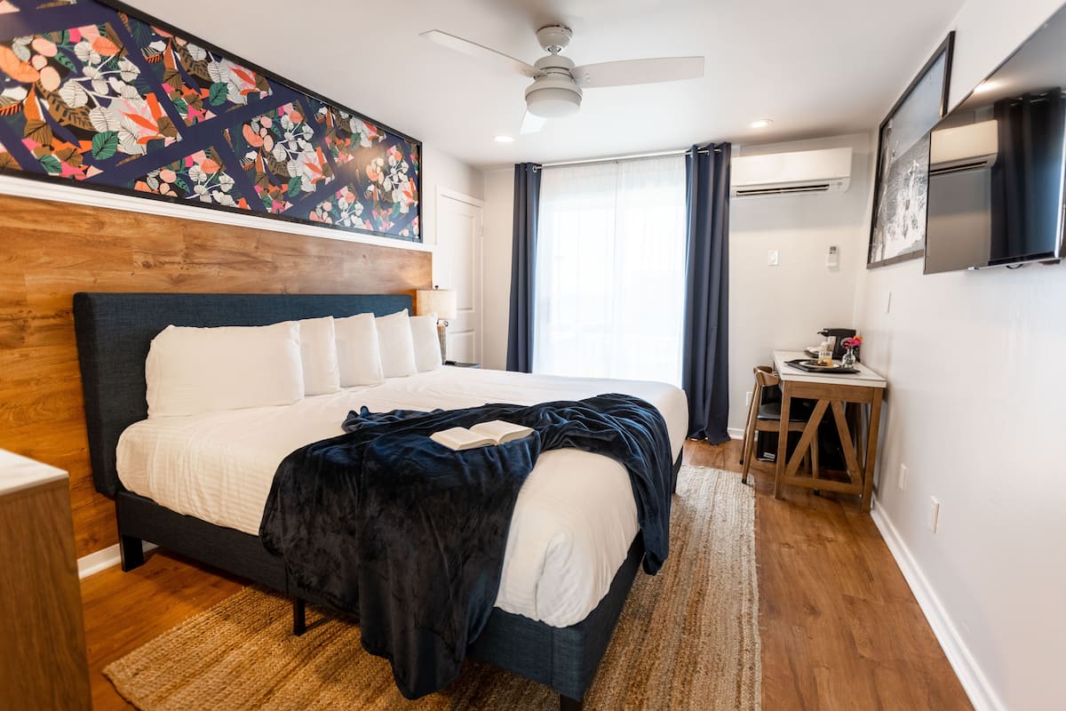 Room, 1 King Bed, Balcony, Poolside | 2 bedrooms, individually furnished, laptop workspace, blackout drapes