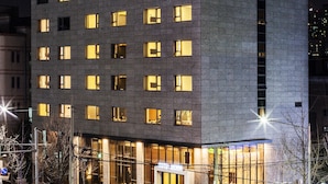 A multi-story hotel with illuminated signage reading "Hotel Denim." - Hotel Denim (Seoul)