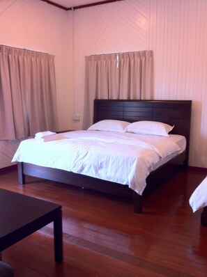 Desk, iron/ironing board, bed sheets