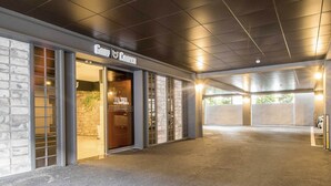 A hotel entrance with a sign reading "Gary Cooper Hotel."