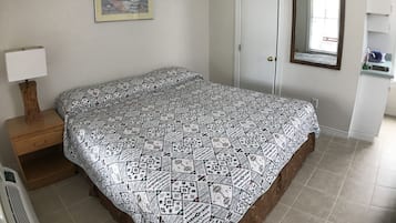 Laptop workspace, bed sheets