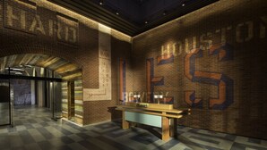 A spacious lobby with a high ceiling, a checkered floor, and a prominent 'HOUSTON' mural on the wall. - Hotel Indigo Lower East Side New York by IHG (New York)