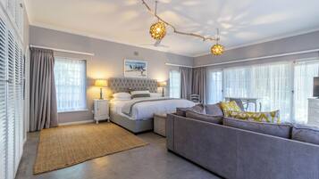 Executive Suite | Minibar, in-room safe, individually decorated, desk