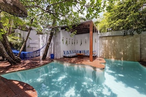 Outdoor pool, open 7:00 AM to 10:00 PM, pool loungers
