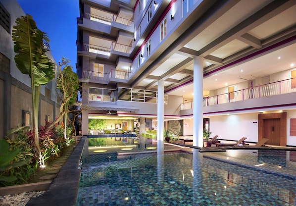 Outdoor pool, open 6:00 AM to 6:00 PM, pool loungers