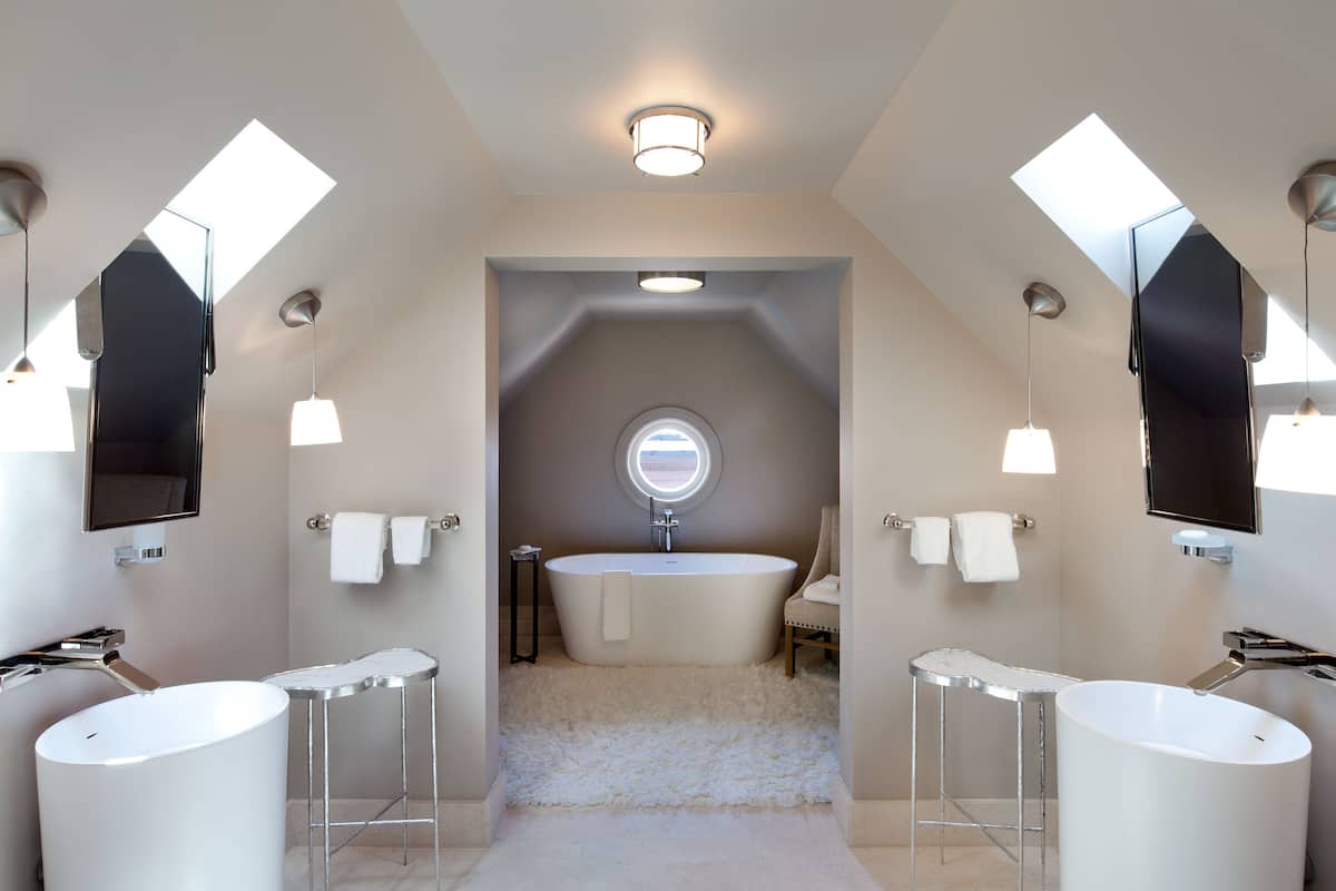suite (seventeen) | bathroom | hydromassage showerhead, designer toiletries, hair dryer, bathrobes
