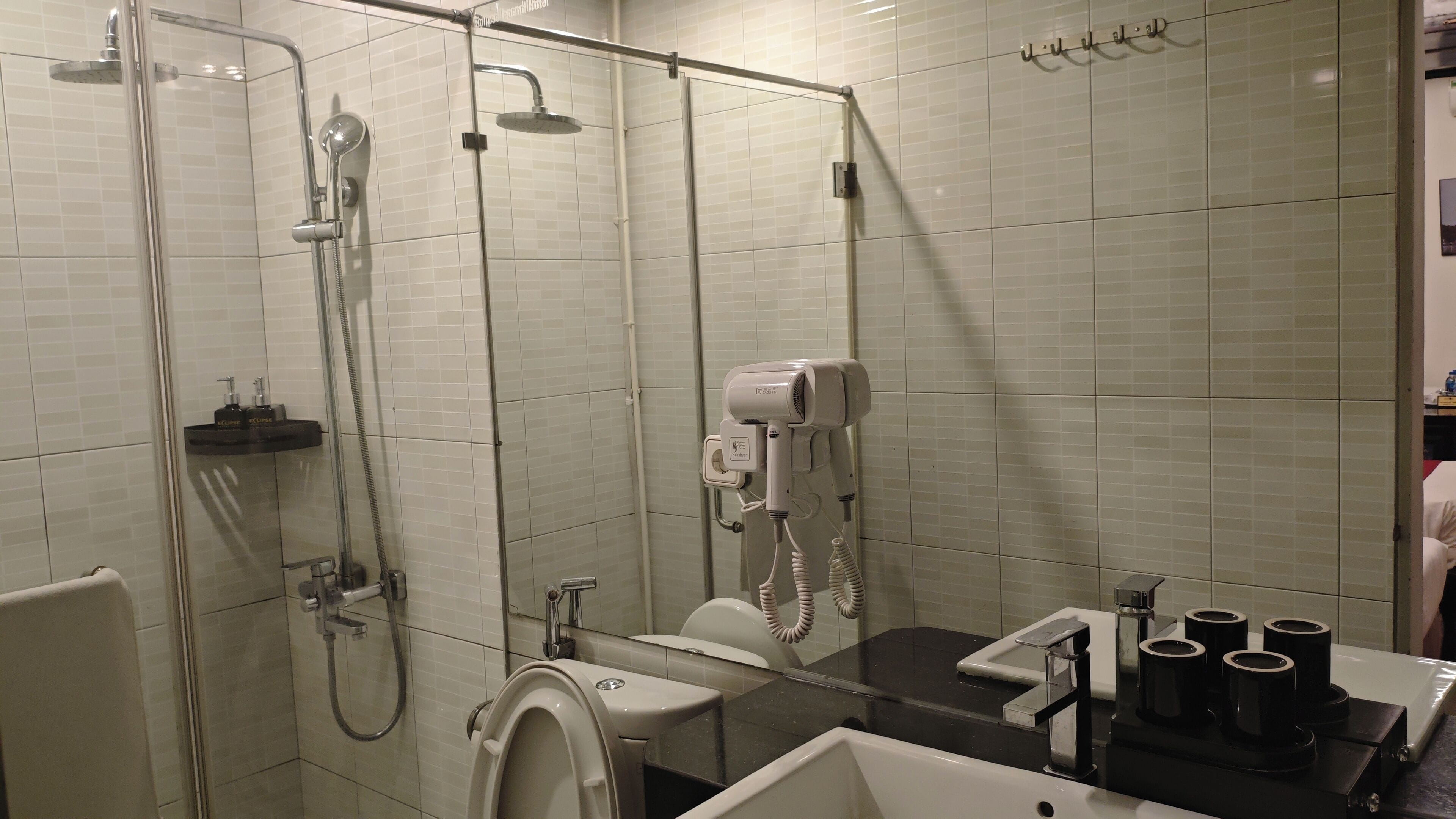 standard triple room | living area | 40-inch flat-screen tv with cable channels, tv