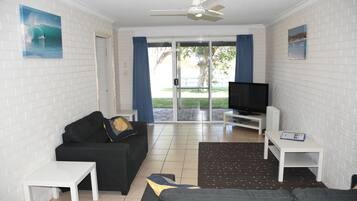 Two Bedroom Waterfront Unit | Living area | 40-inch flat-screen TV with digital channels, TV